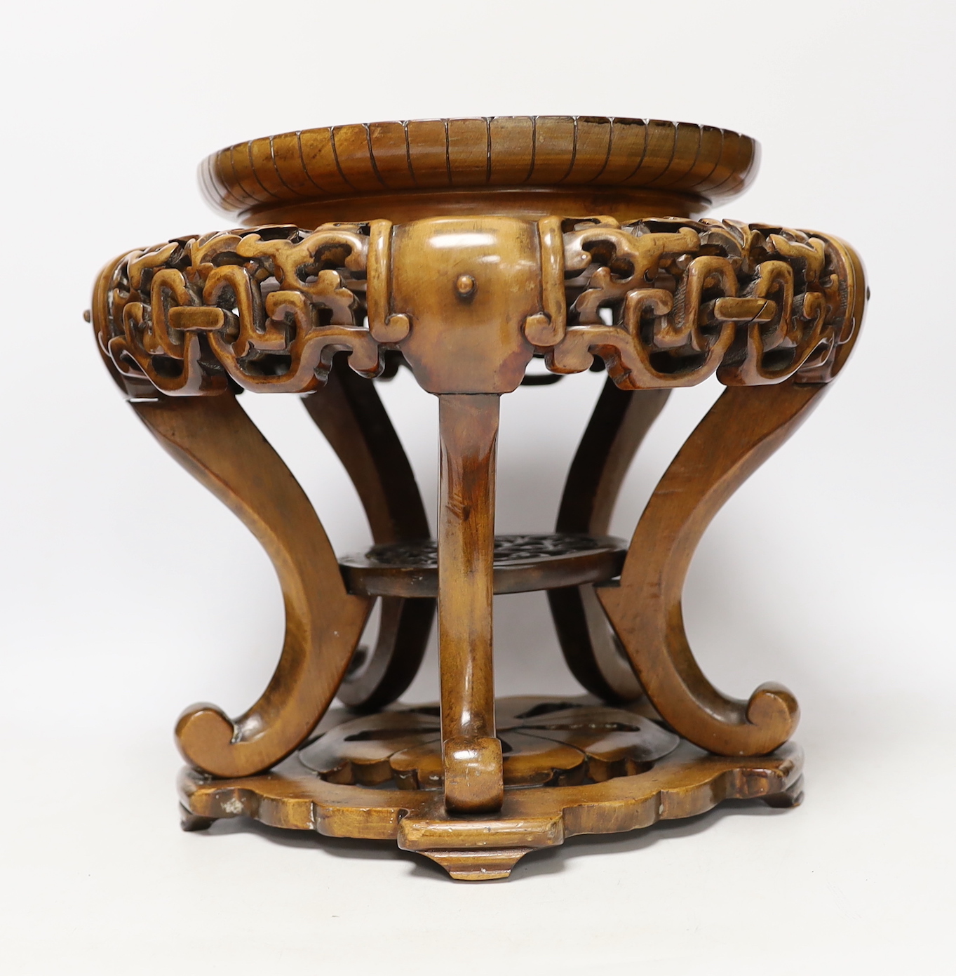 A Chinese carved wood jardiniere stand, 26cm